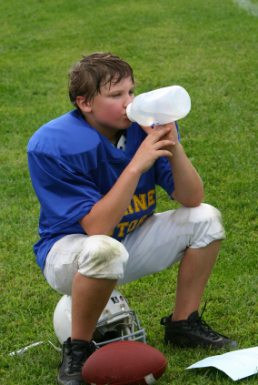 football player drinking from water bottle