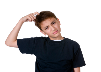 Boy scratching head trying to remember