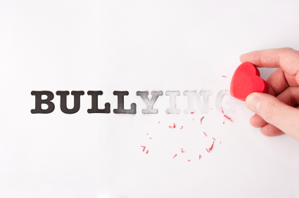 Erasing bullying with heart shaped red eraser