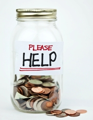 Donation jar with Please Help on label