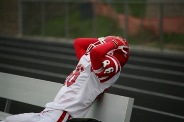 Football player holding his head