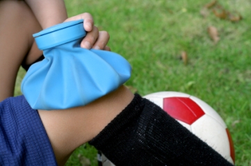 Ice bag on a soccer player's injured knee
