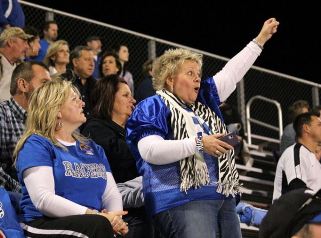 Moms cheering at football game