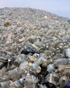Mountain of plastic water bottles in landfill