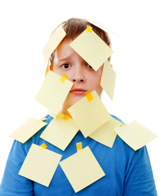 Boy with post it notes on head