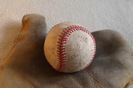 Old time baseball glove and ball
