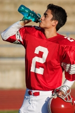 Football player rehydrating