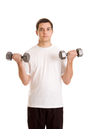 Teenage boy with hand weights
