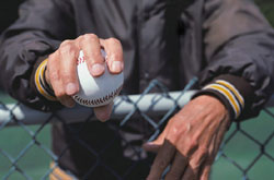 Coach holding baseball
