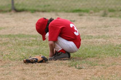 Youth baseball player after a loss