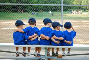 Little League baseball team on bench